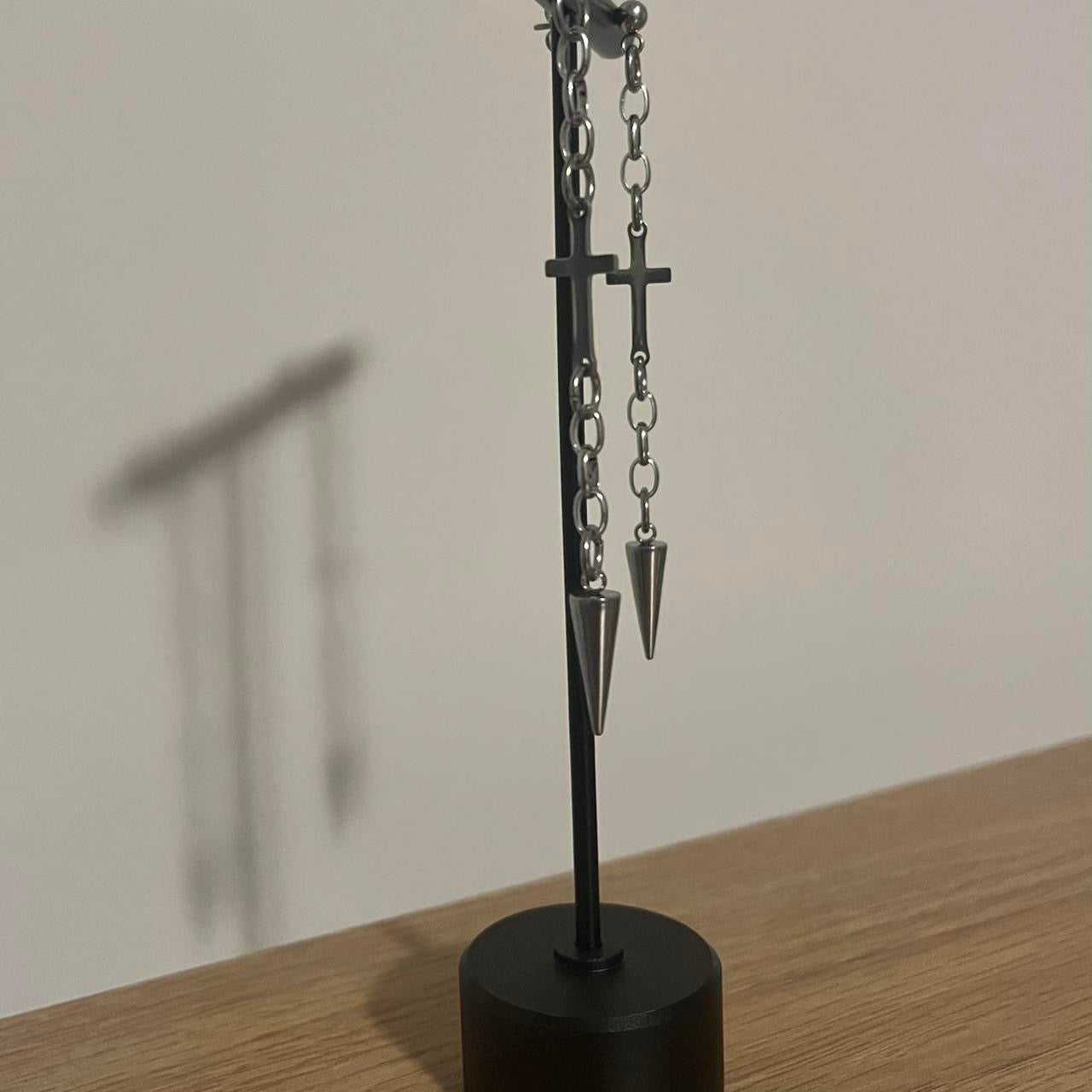 hanging cross and spike earrings